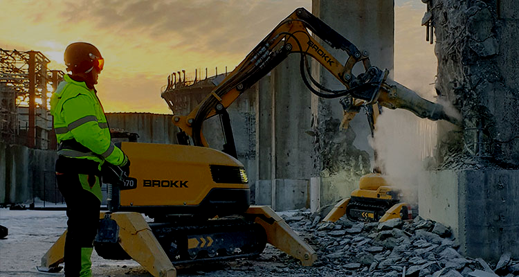 Remote-controlled Brokk demolition robots breaking concrete with the operator outside the workface