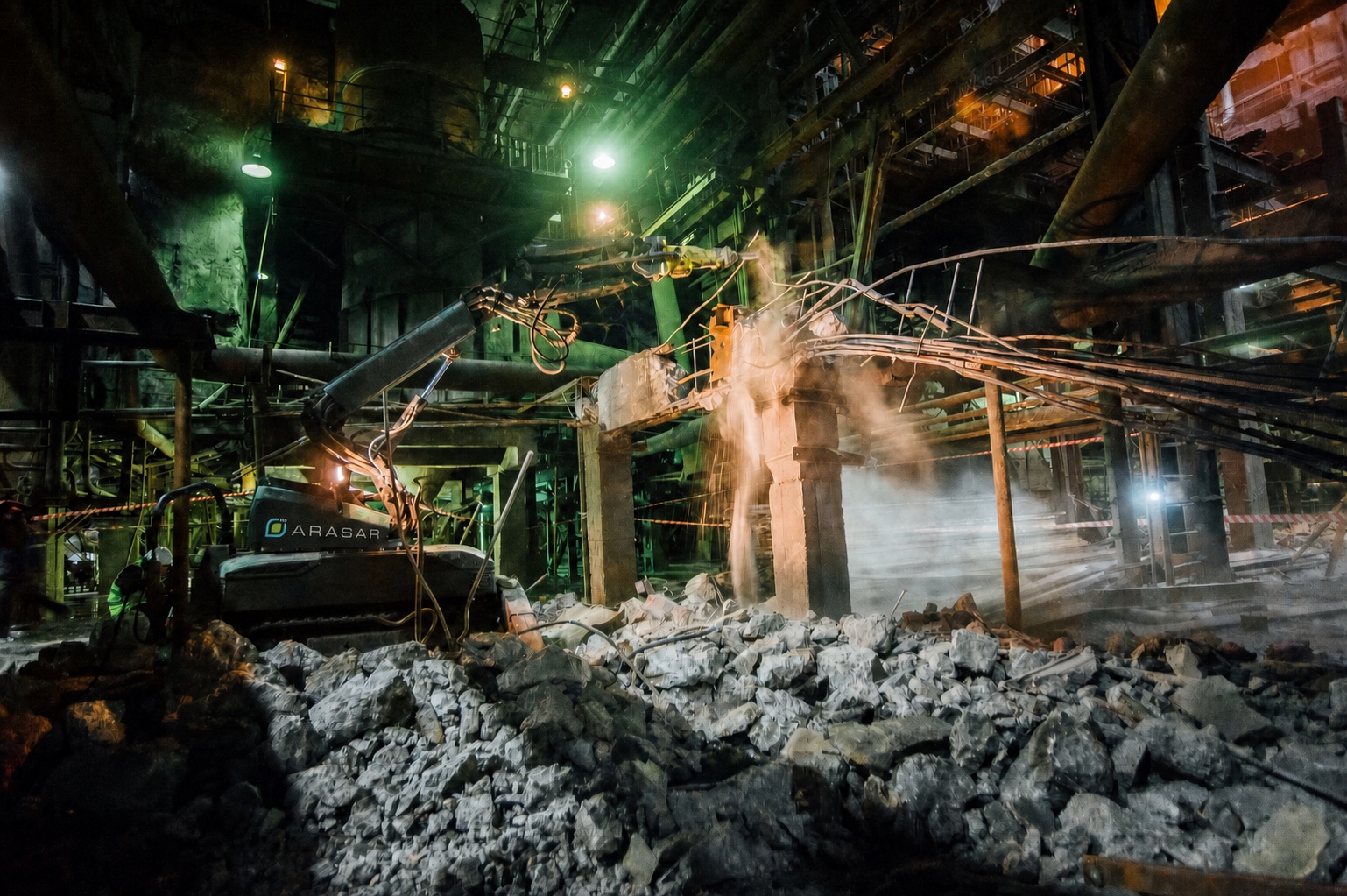 Arasar remote-controlled demolition robot breaking reinforced concrete in an industrial facility
