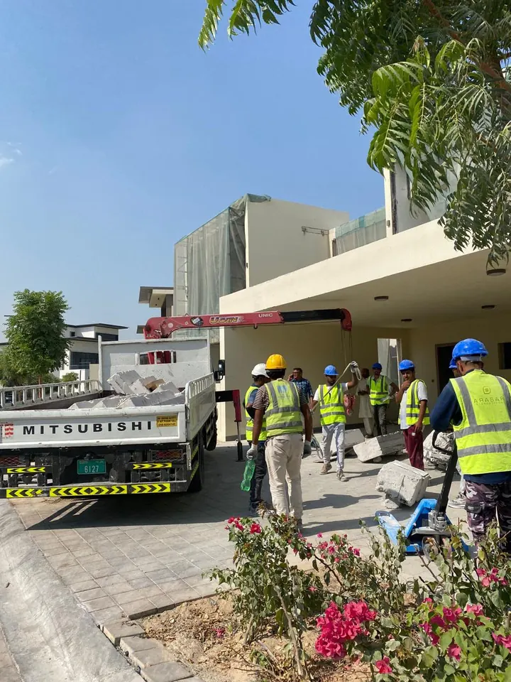 Arasar crew beside a crane truck and removed concrete pieces outside a villa